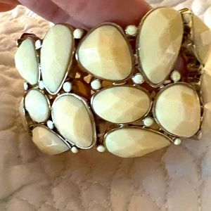 Gold tone and cream stone elastic band bracelet